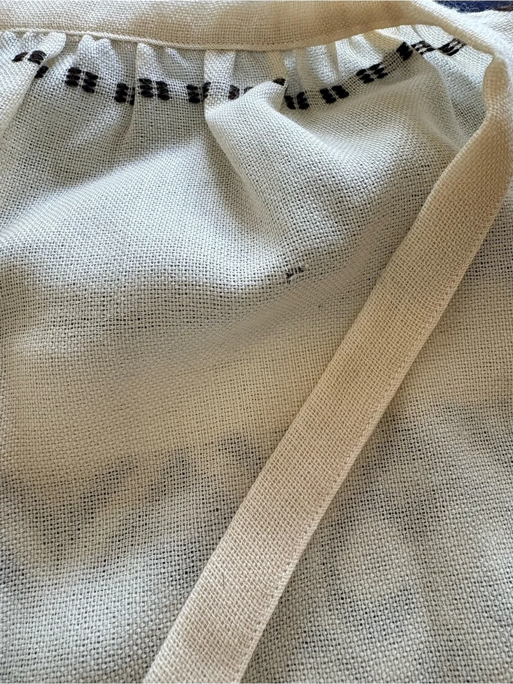Arola 100% Wool Cream Apron with Black Geometric Pattern